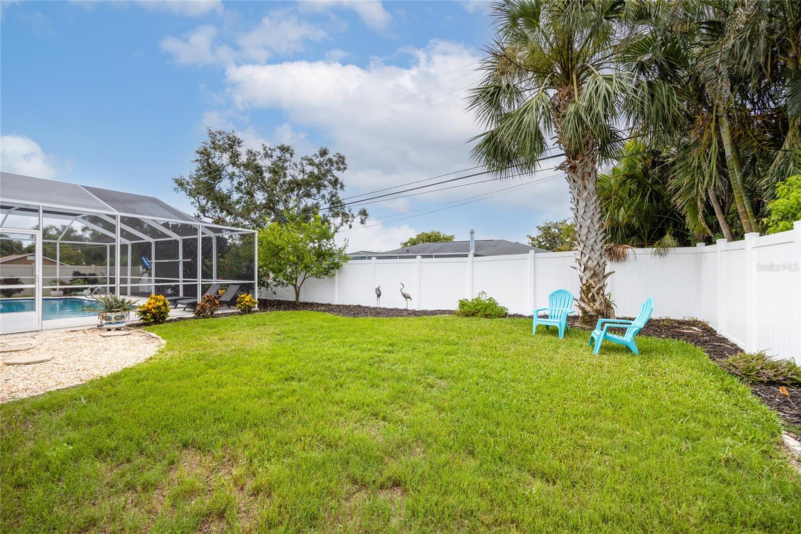 Plenty of yard area outside of the Lanai for pets and/or playsets!    Or maybe you will plant a garden?