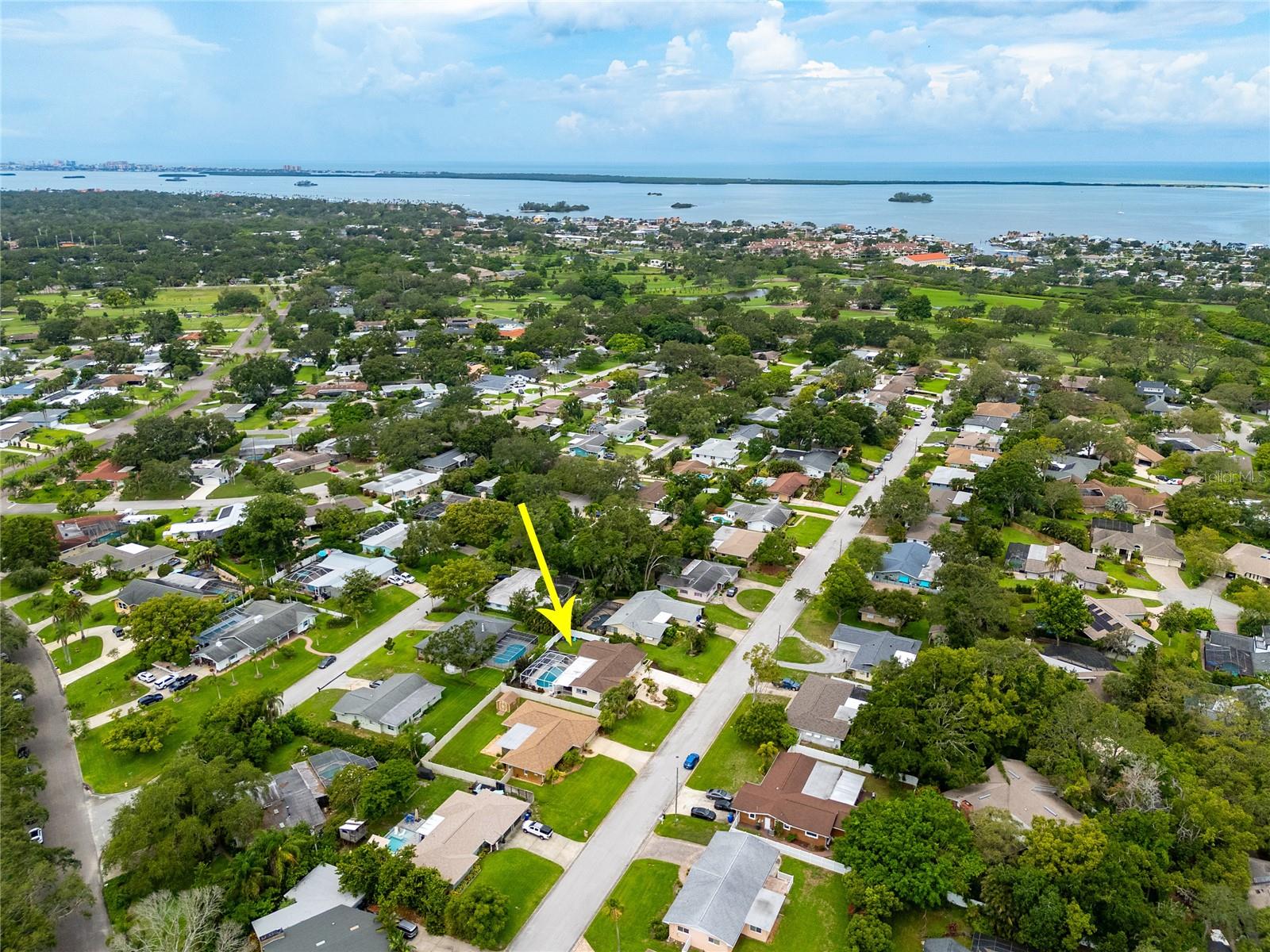 This aerial view shows the proximity to the Dunedin Golf Club as well as the beautiful waters of the Gulf of Mexico