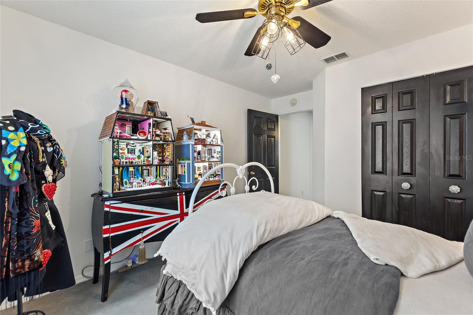 A large closet and ceiling fan make this room cozy and comfortable.