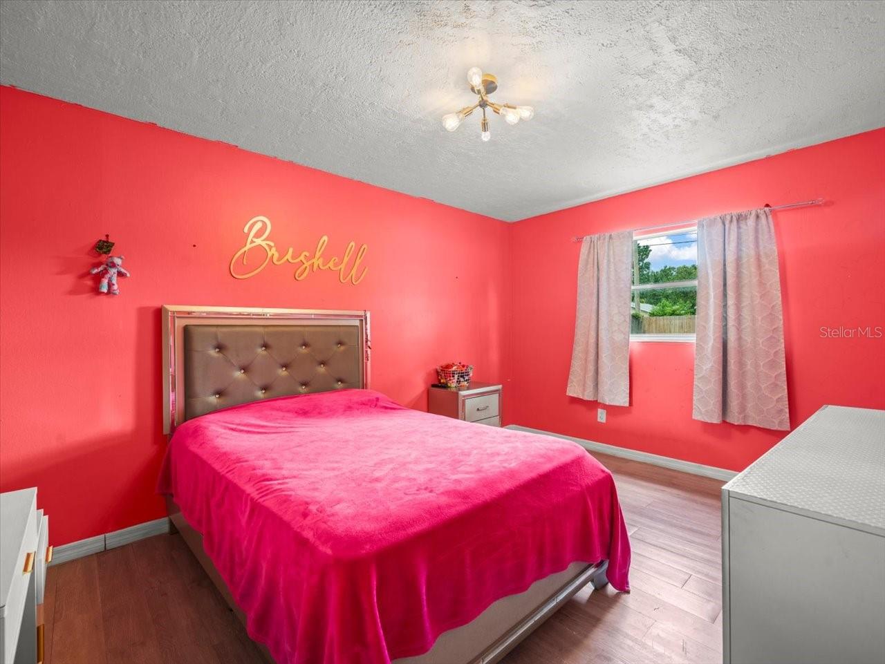 Primary bedroom with walk-in closet.
