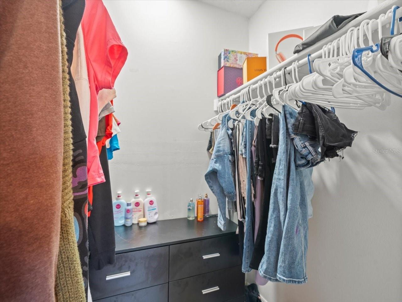Primary bedroom walk-in closet.