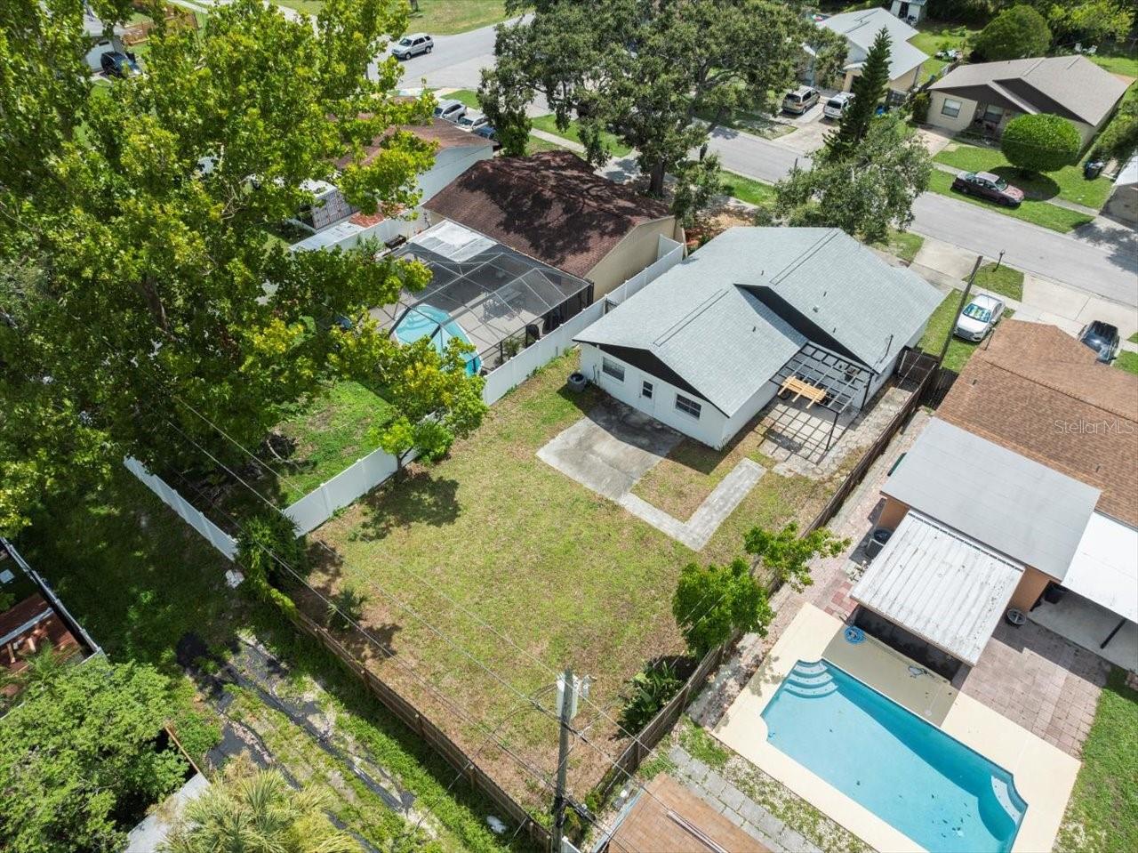 Aerial view of large fenced yard.