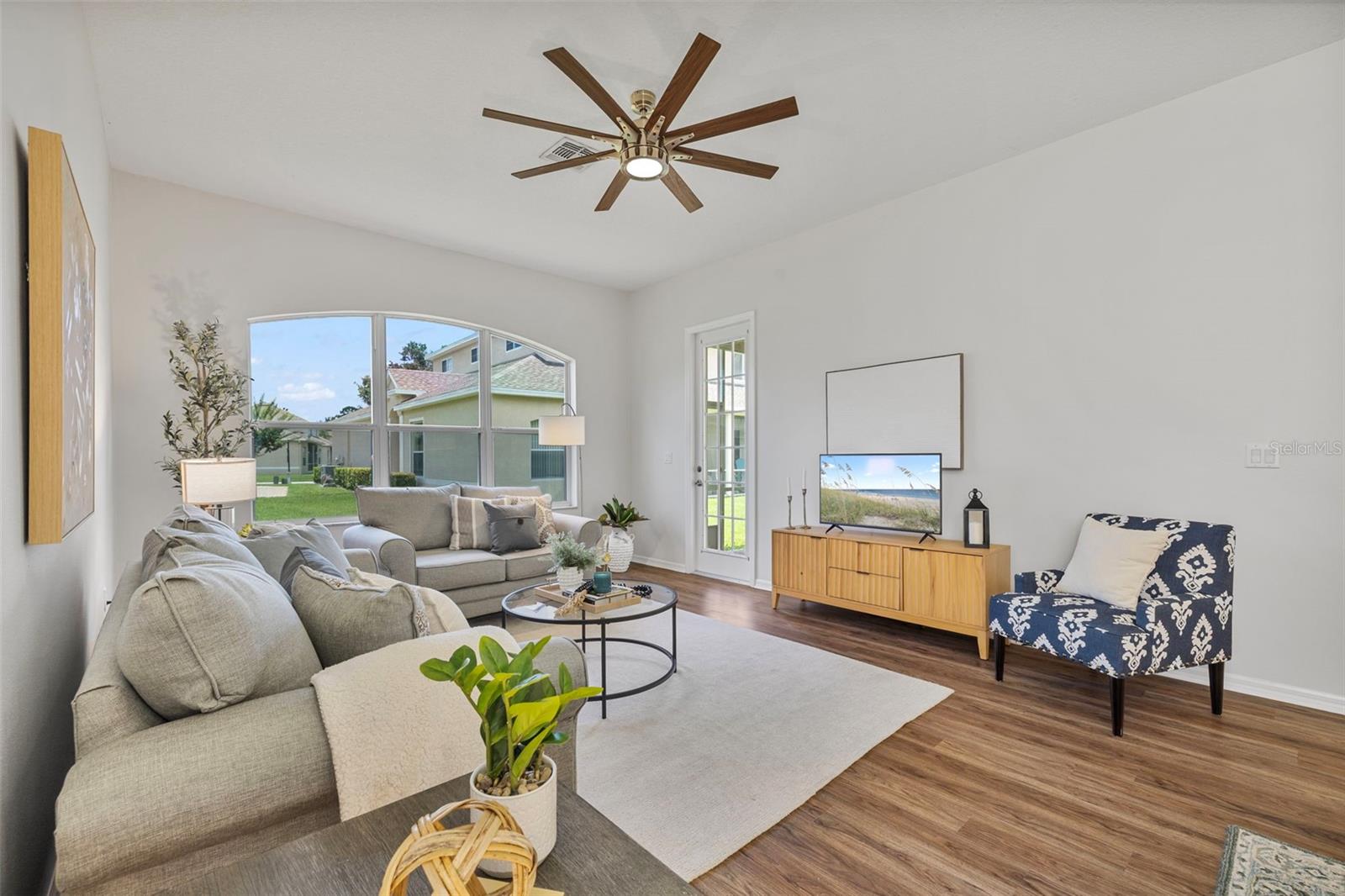 family room has a door to the screened patio
