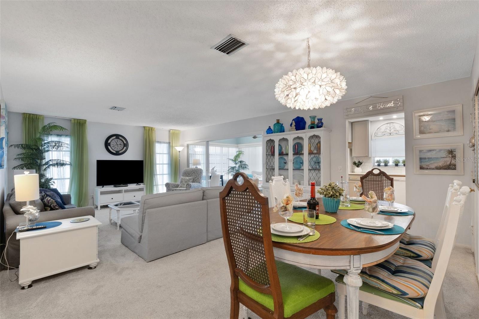 Dining Area Open to Living Room and Kitchen Entrance Behind