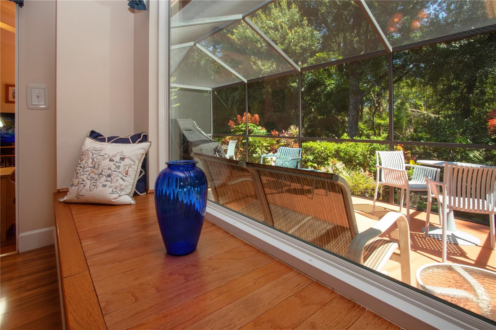 Dining Room w/window seat looking out onto the lanai