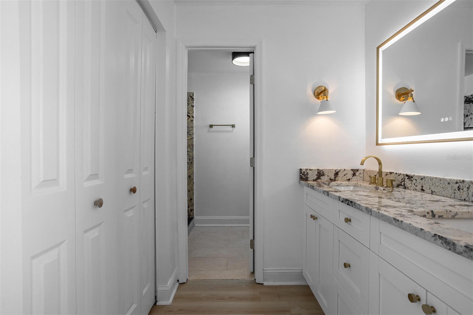 Primary Closet to the Left and His and Her Sinks to the Right