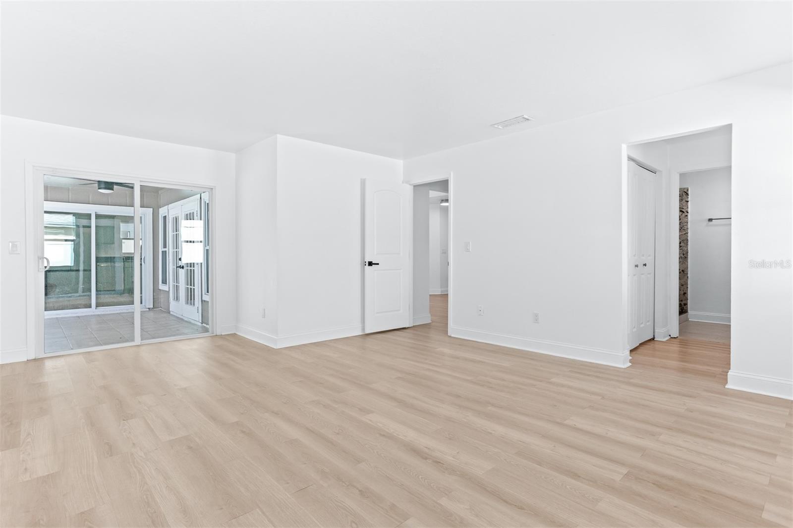Primary Bedroom with Private Slider to the Back Patio and Pool