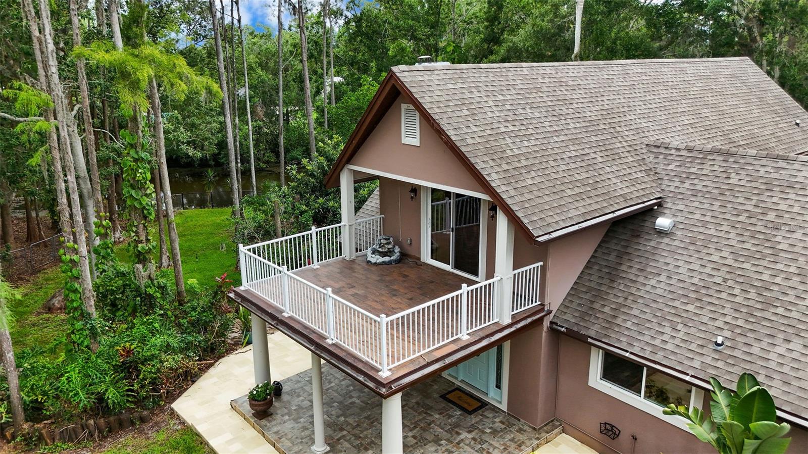Balcony overlooks the private front yard