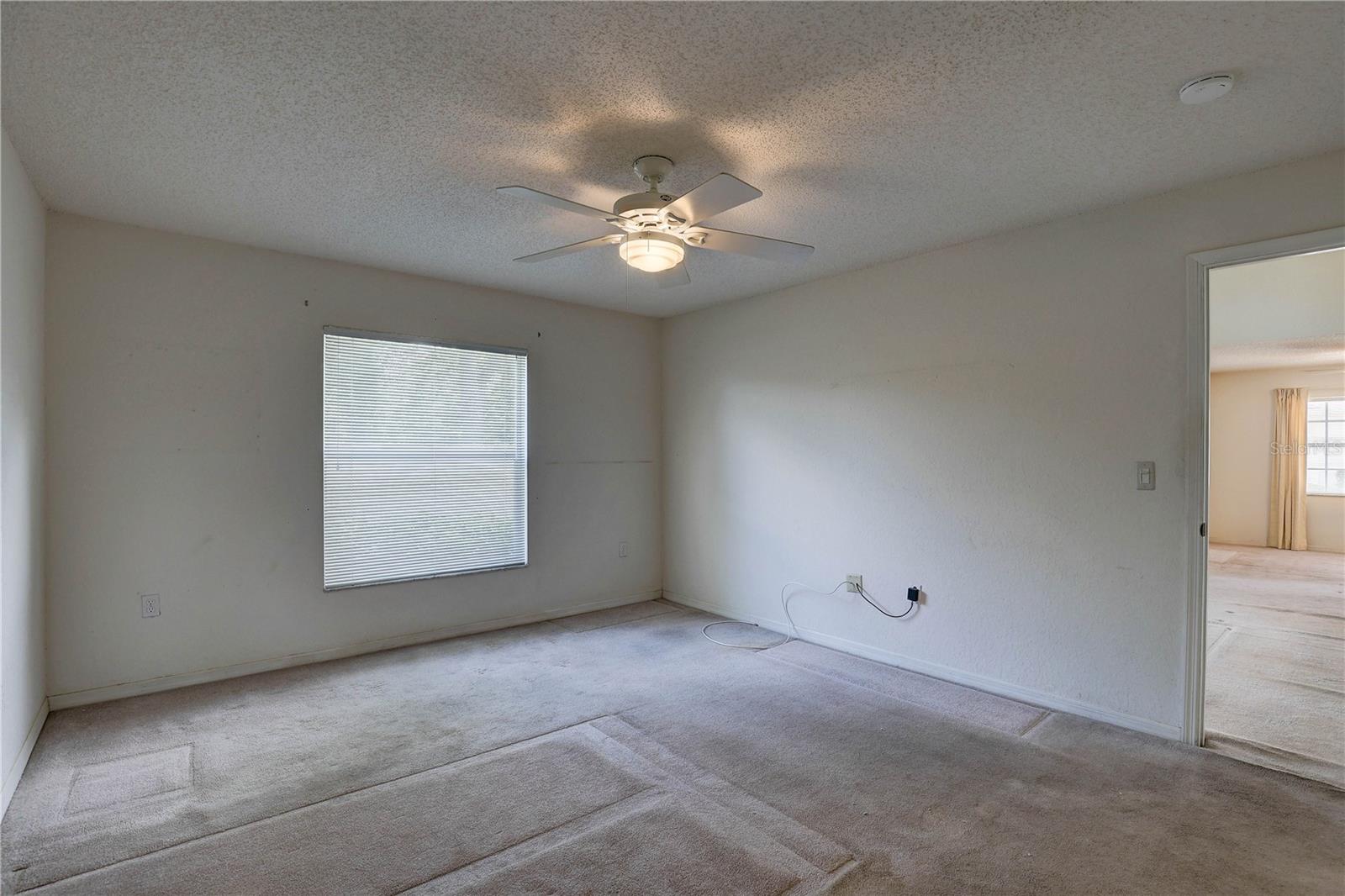 First floor primary bedroom off the living area