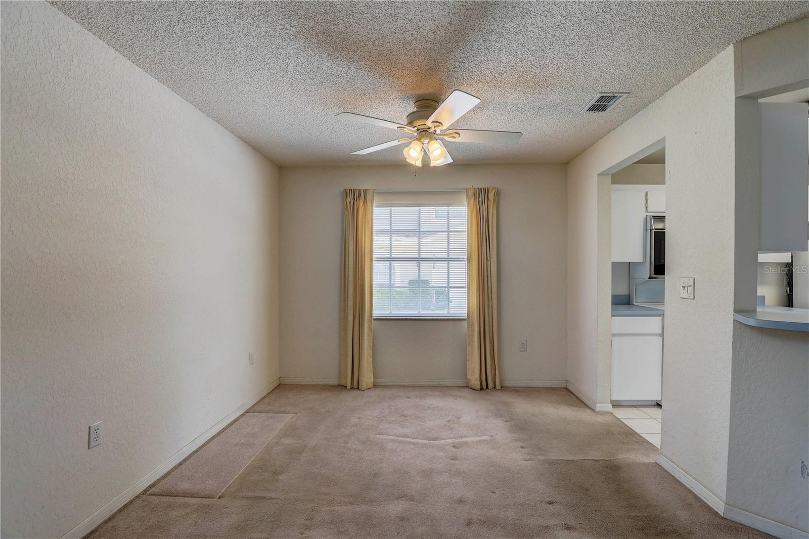 Dining area with kitchen on right