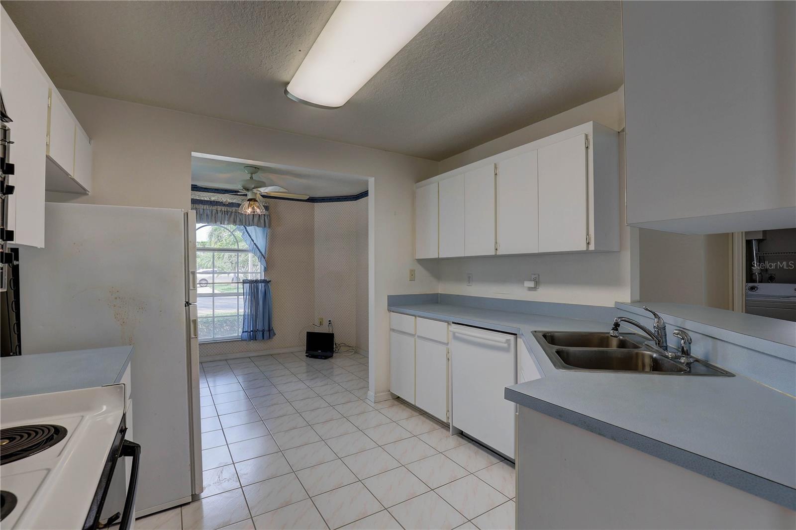 Kitchen with breakfast nook in back