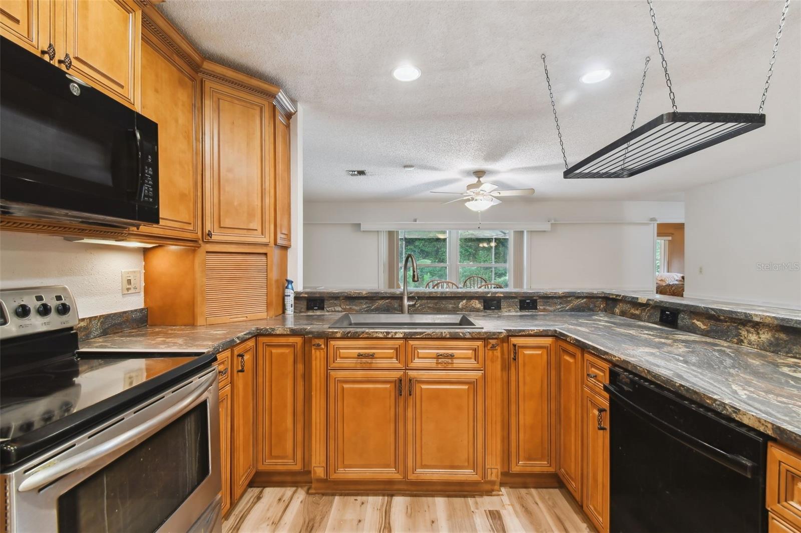 Pull out spice racks to each side of sink and turntables in each corner.