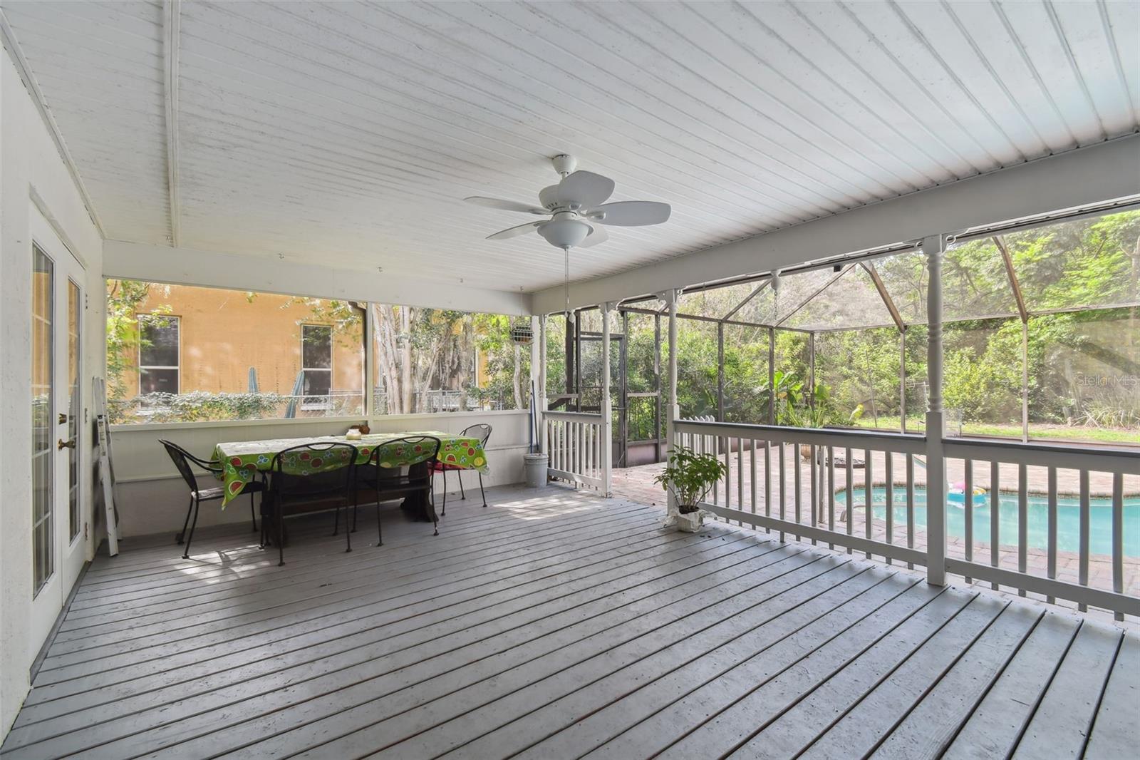 Great screened-in porch...perfect for a large table and seating area for dining and entertaining!