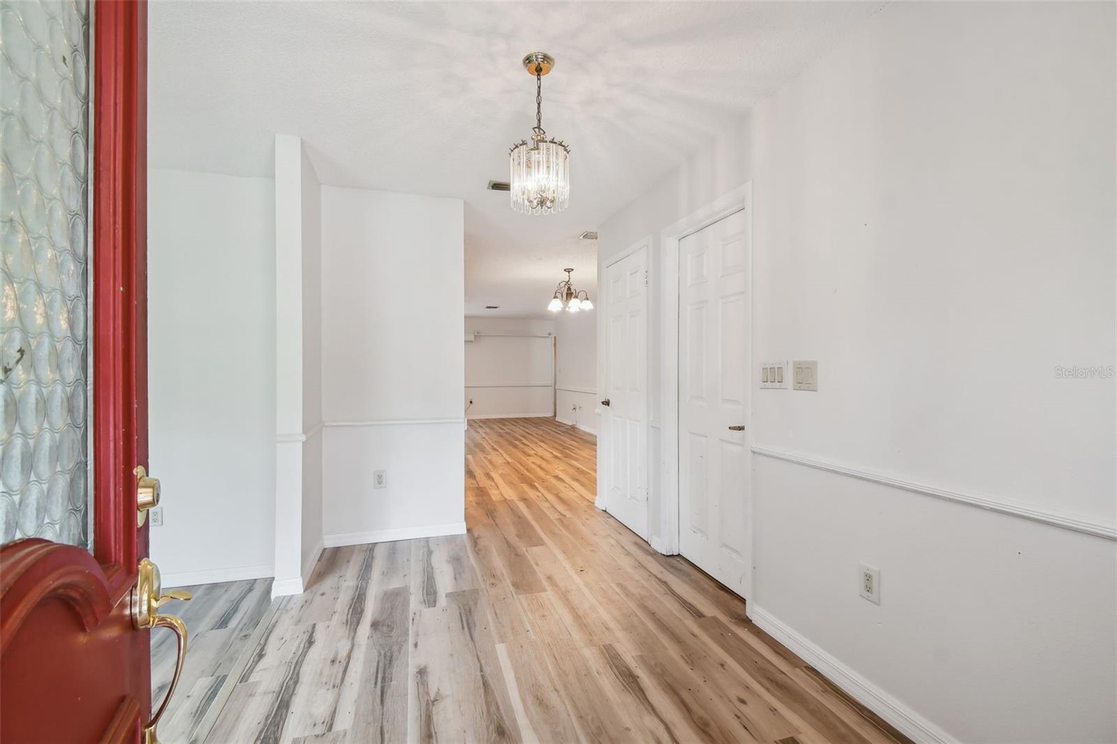 Formal foyer with living room to the left...straight back to open living area with kitchen, breakfast and family room