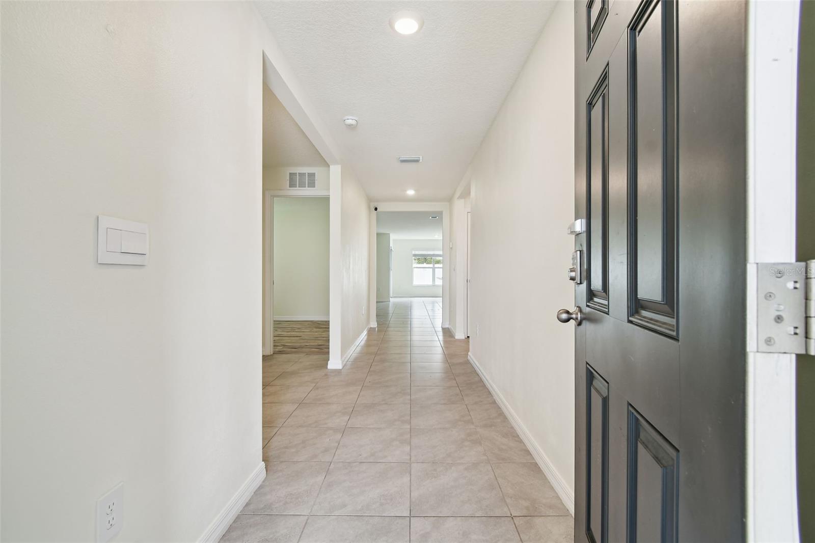 Enter this generous foyer with room for a foyer table and art gallery wall.