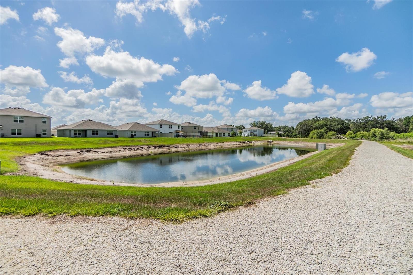 This is the POND to the right of the home! (And it has a walking trail!)
