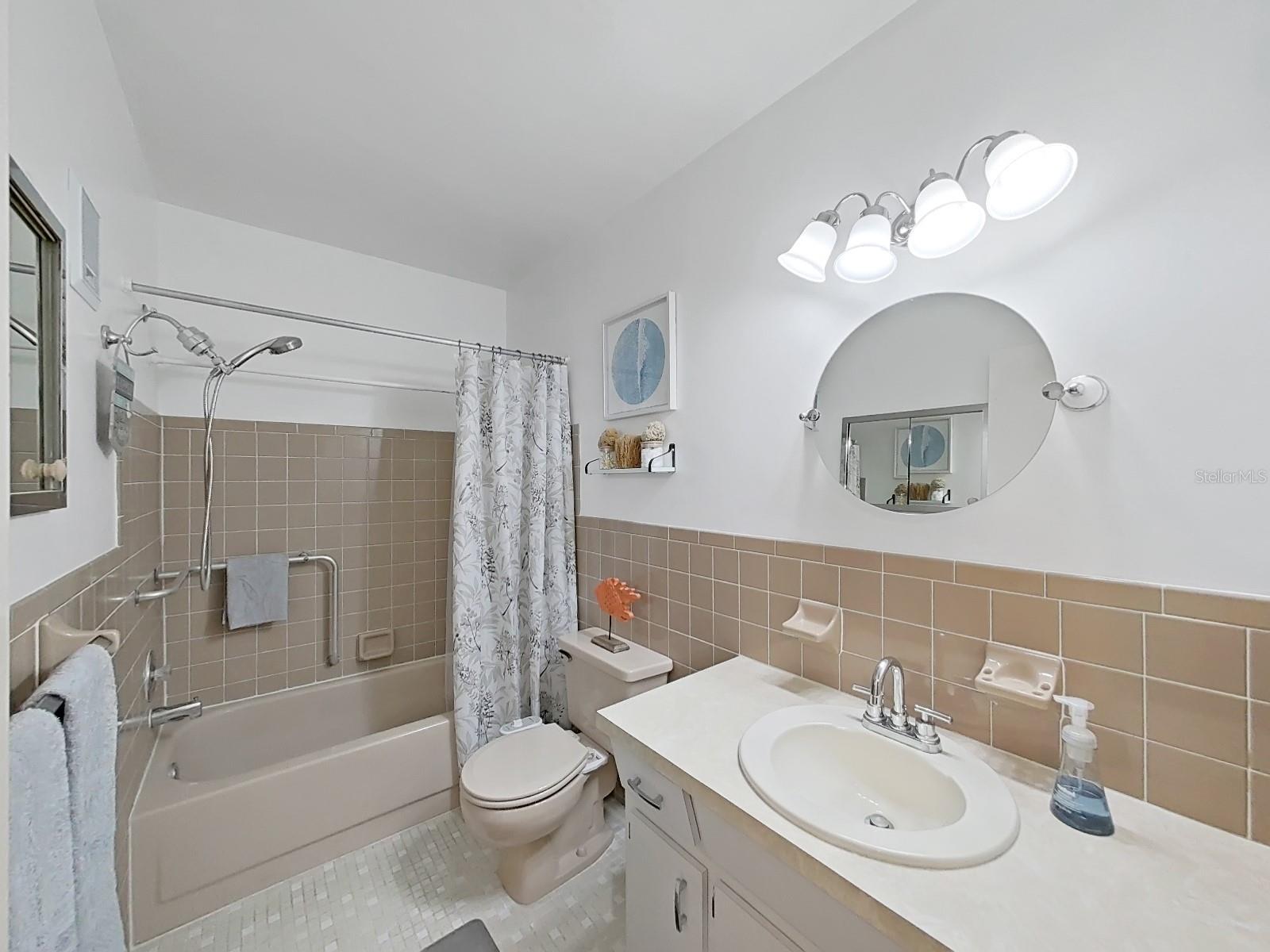 Guest Bathroom has tub/shower combo.