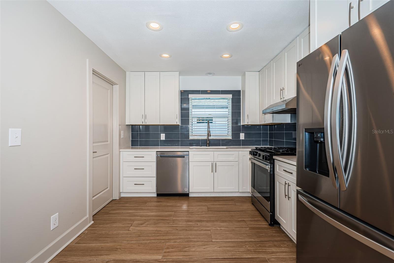 Kitchen features new cabinets and appliances!