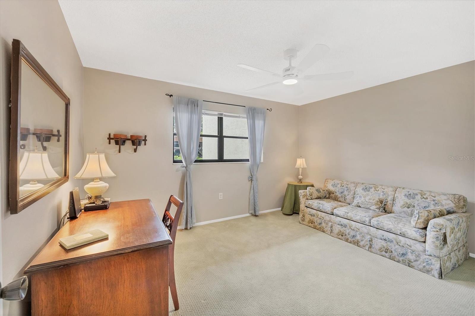 Guest bedroom with walk-in closet-there is plenty of storage in this condo.