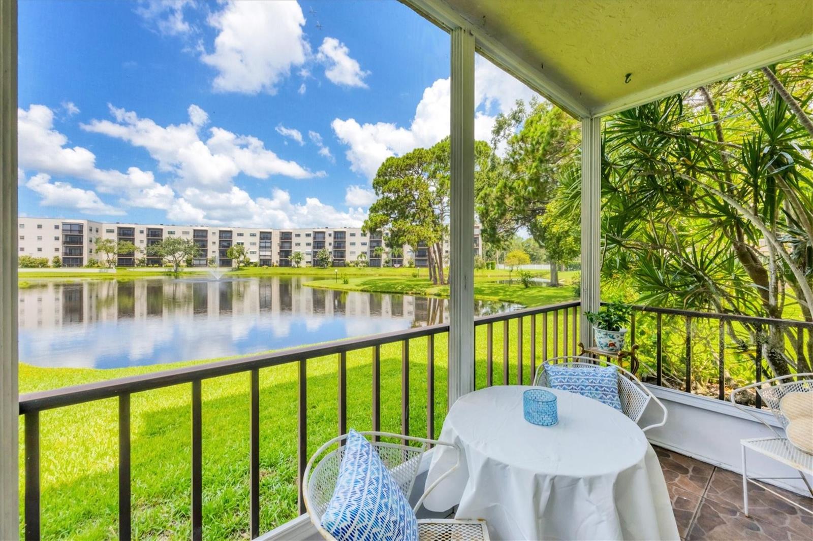 Enjoy the peaceful view of the pond from your screen-in patio