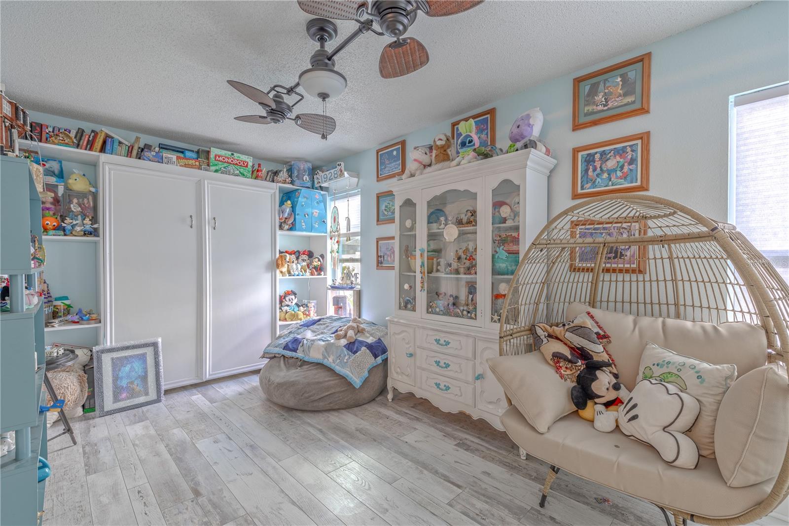 Dual ceiling fans help keep the Florida room cool and comfortable year-round.