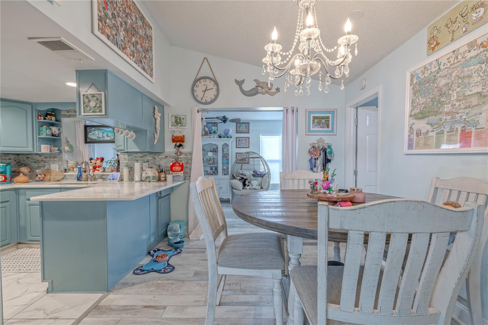 The dining room is adjacent to the kitchen and breakfast bar.