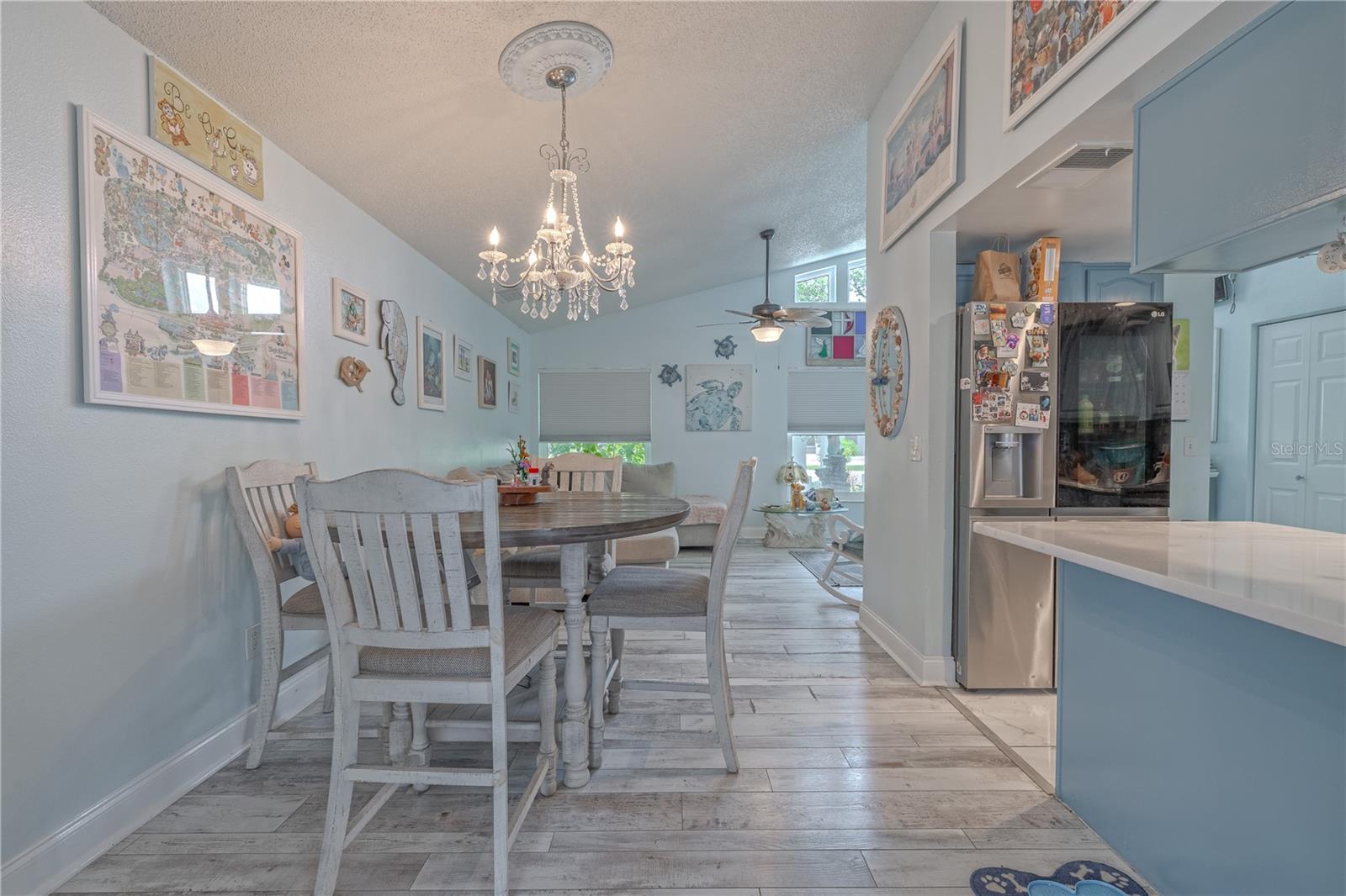 The dining room is open to the living room and kitchen.
