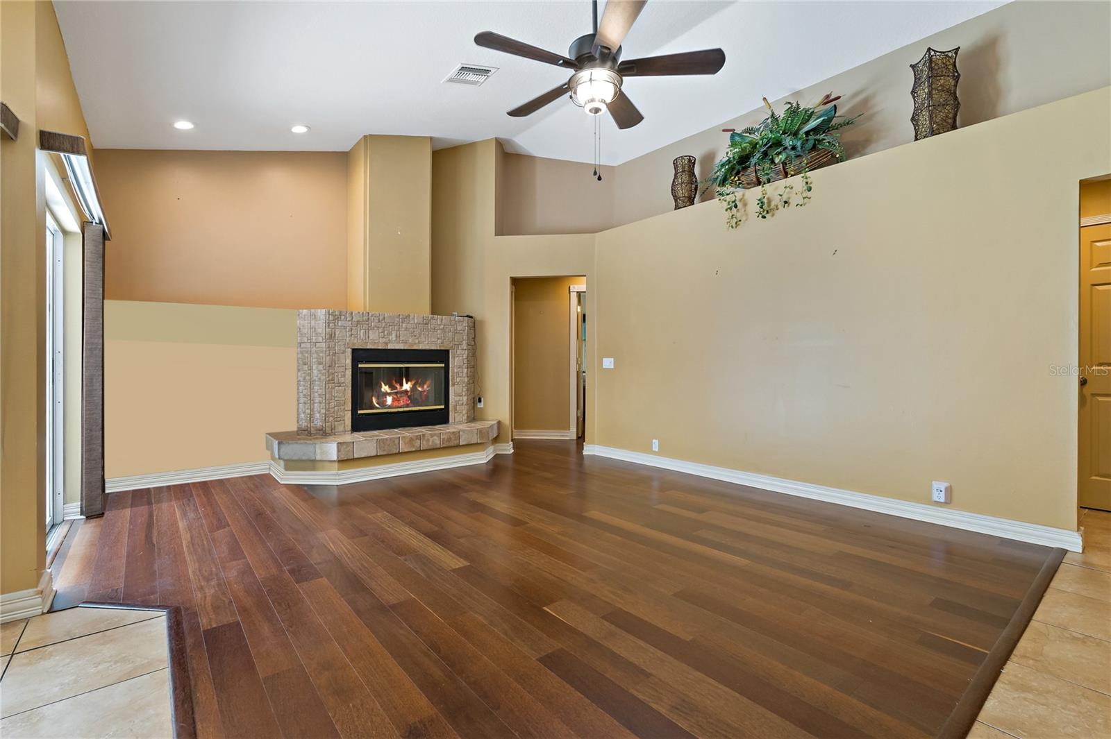 FAMILY ROOM WITH COZY WOOD BURNING FIREPLACE!