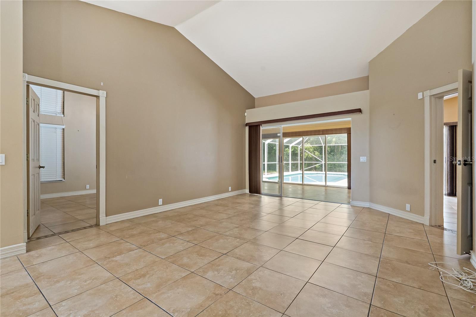 FORMAL LIVING AREA WITH ACCESS TO THE FLORIDA ROOM!