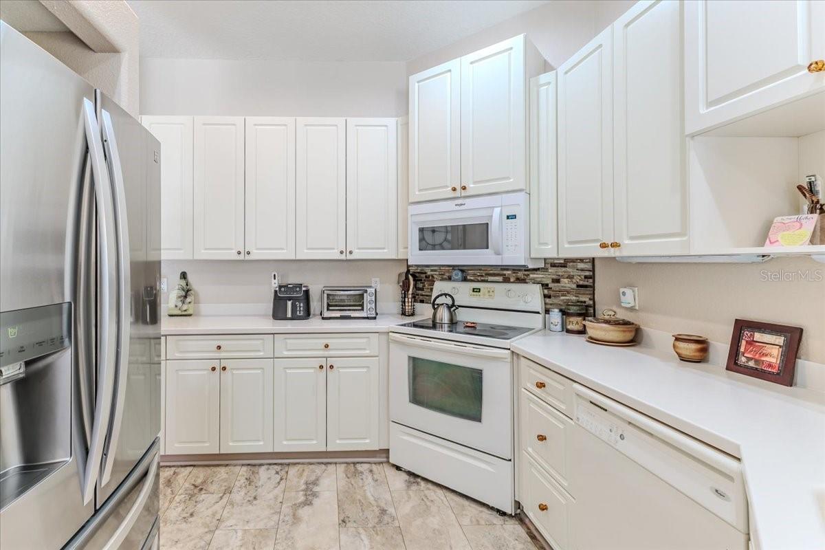White Cabinets & Corian Counters