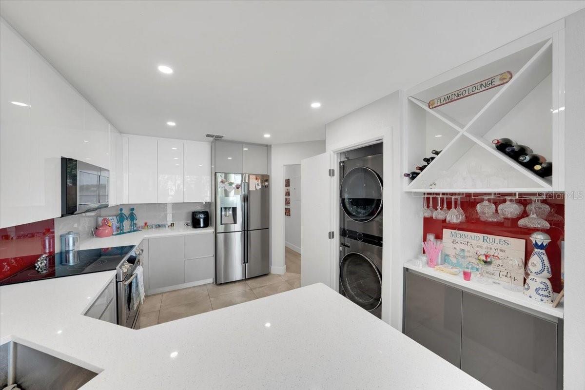 Kitchen area fully renovated with pantry, high grade SS appliances, quarts countertops, wood cabinetry with built in features!