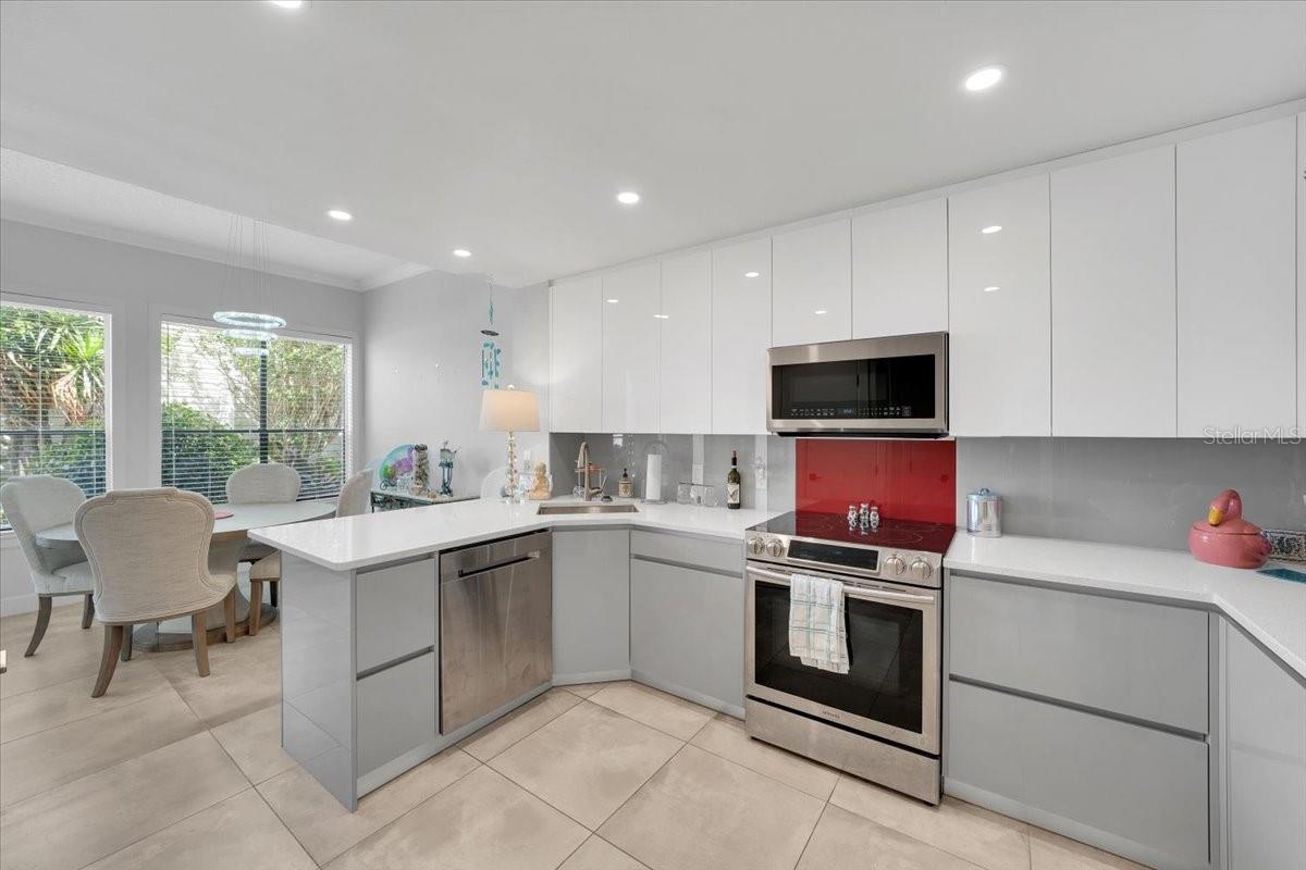 Kitchen area fully renovated with pantry, high grade SS appliances, quarts countertops, wood cabinetry with built in features!