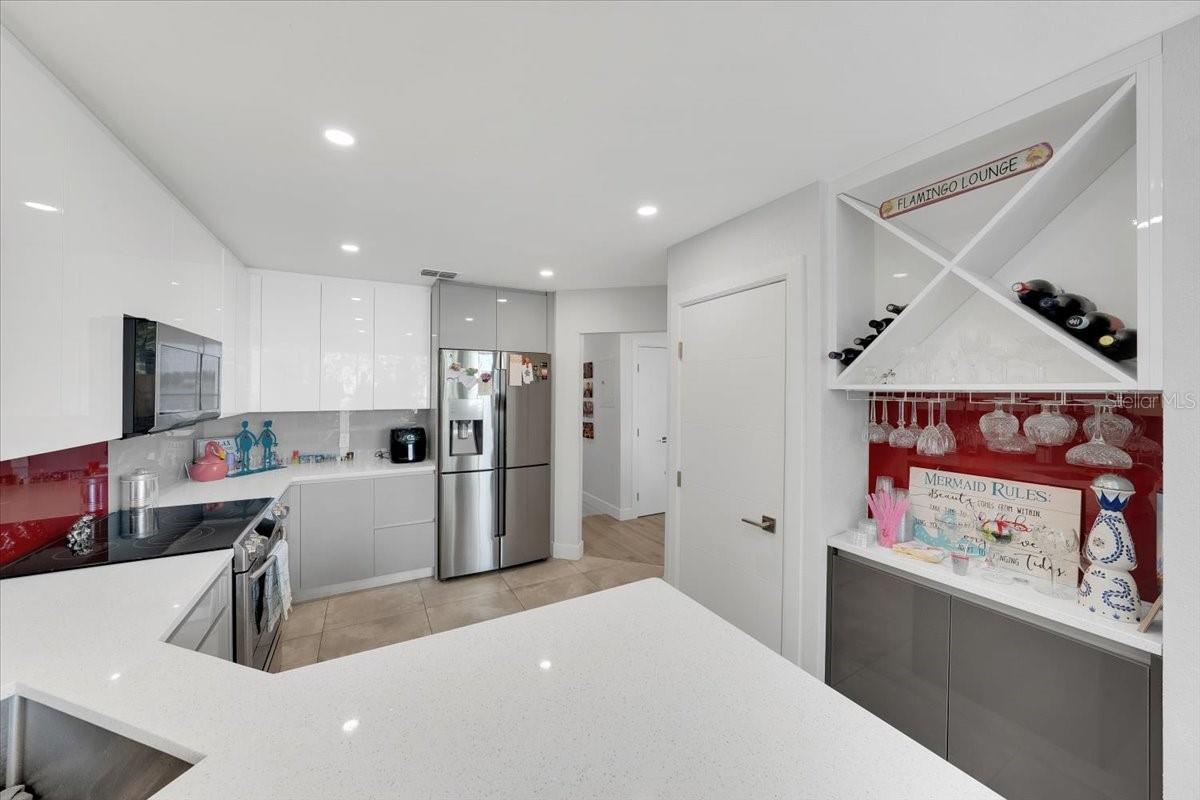 Coffee/liquor nook with lower cabinetry and bottle racks
