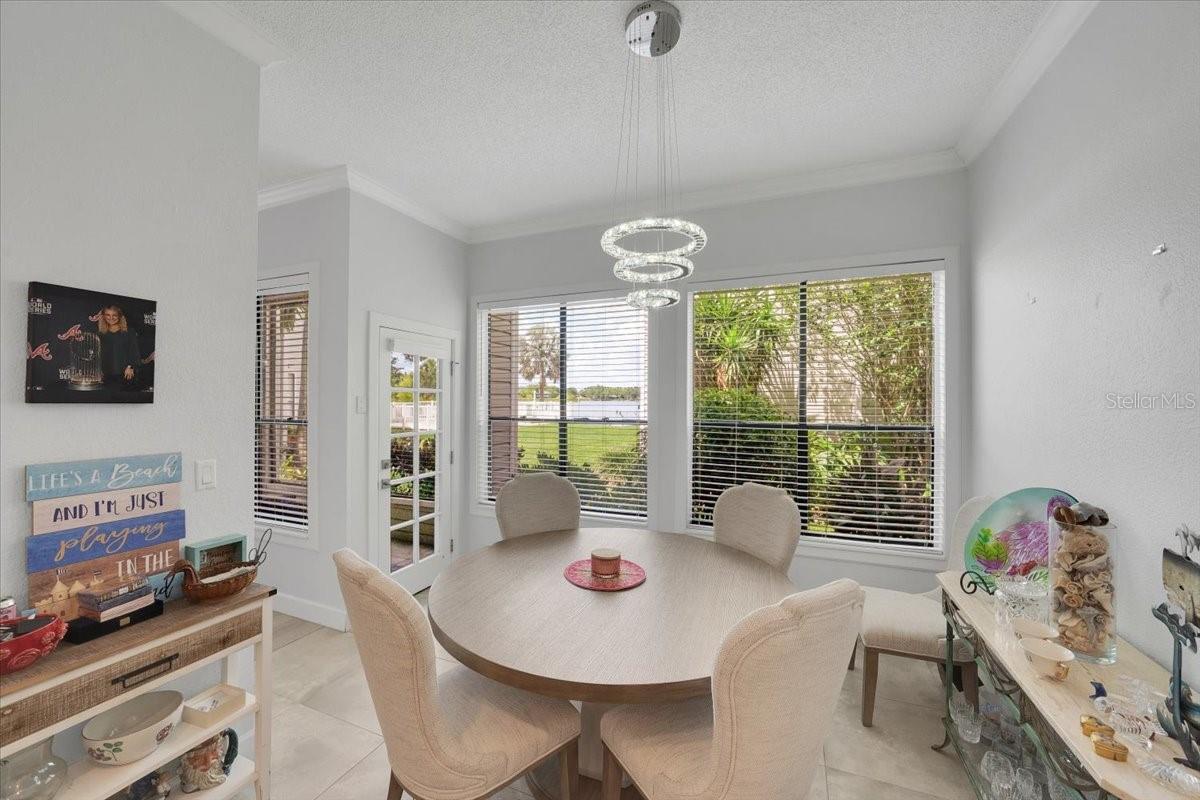 Dining room and glassed lanai door overlooking Egypt Lake