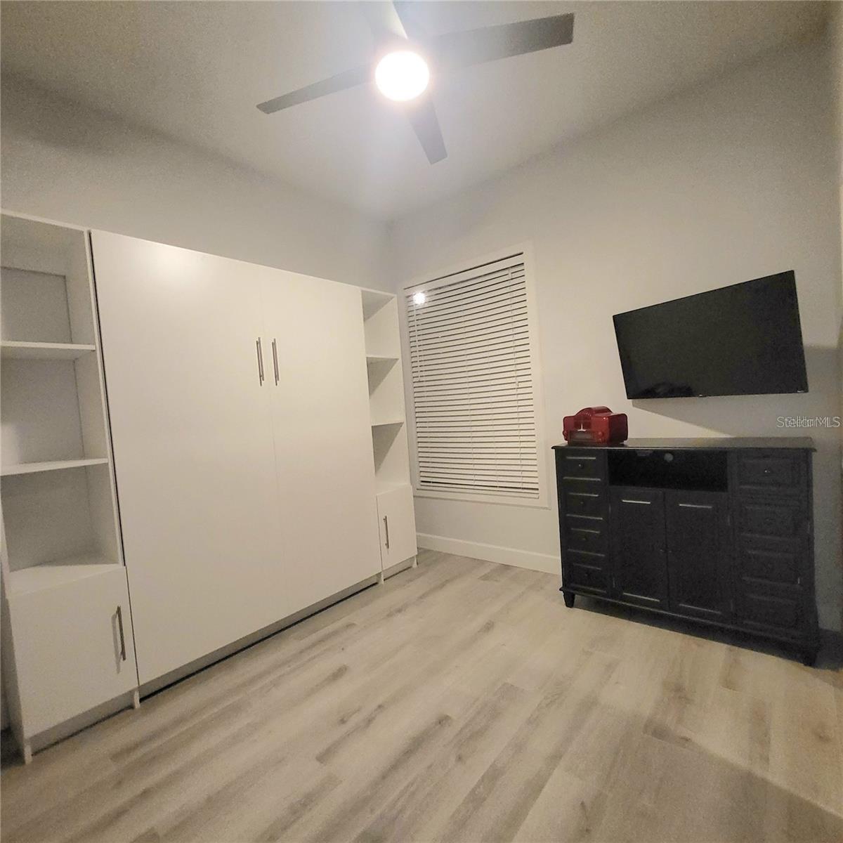 Guest bedroom 2 with murphy bed and built in closets