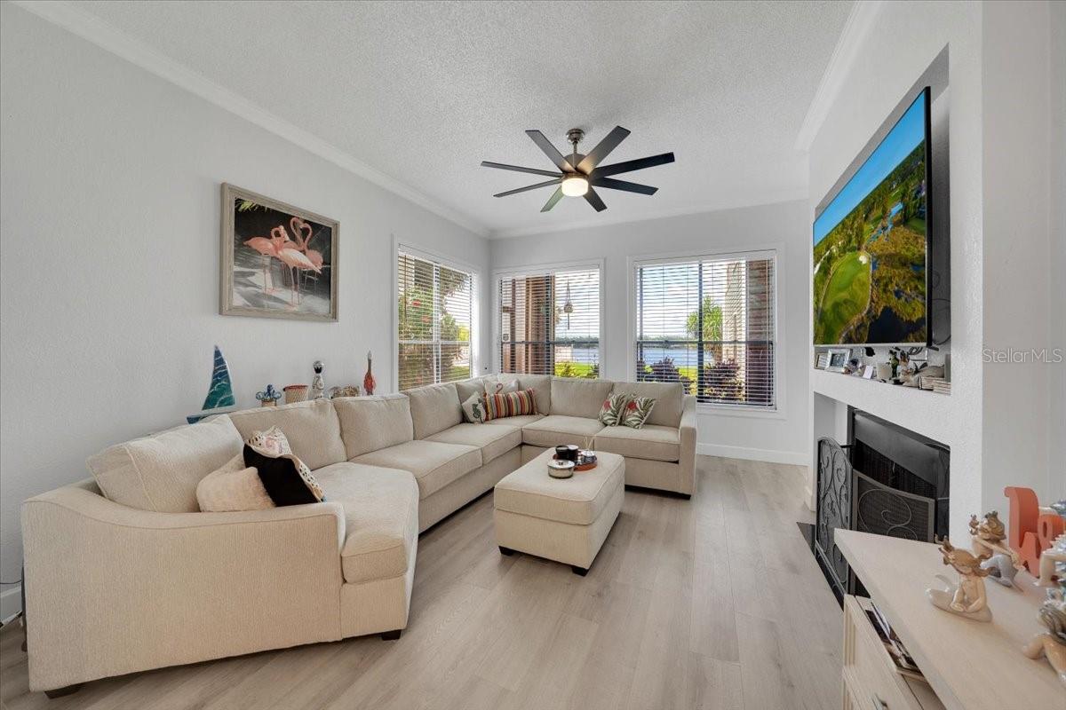 HUGE Living Room through the front door entrance. Windows overlook the Lake!