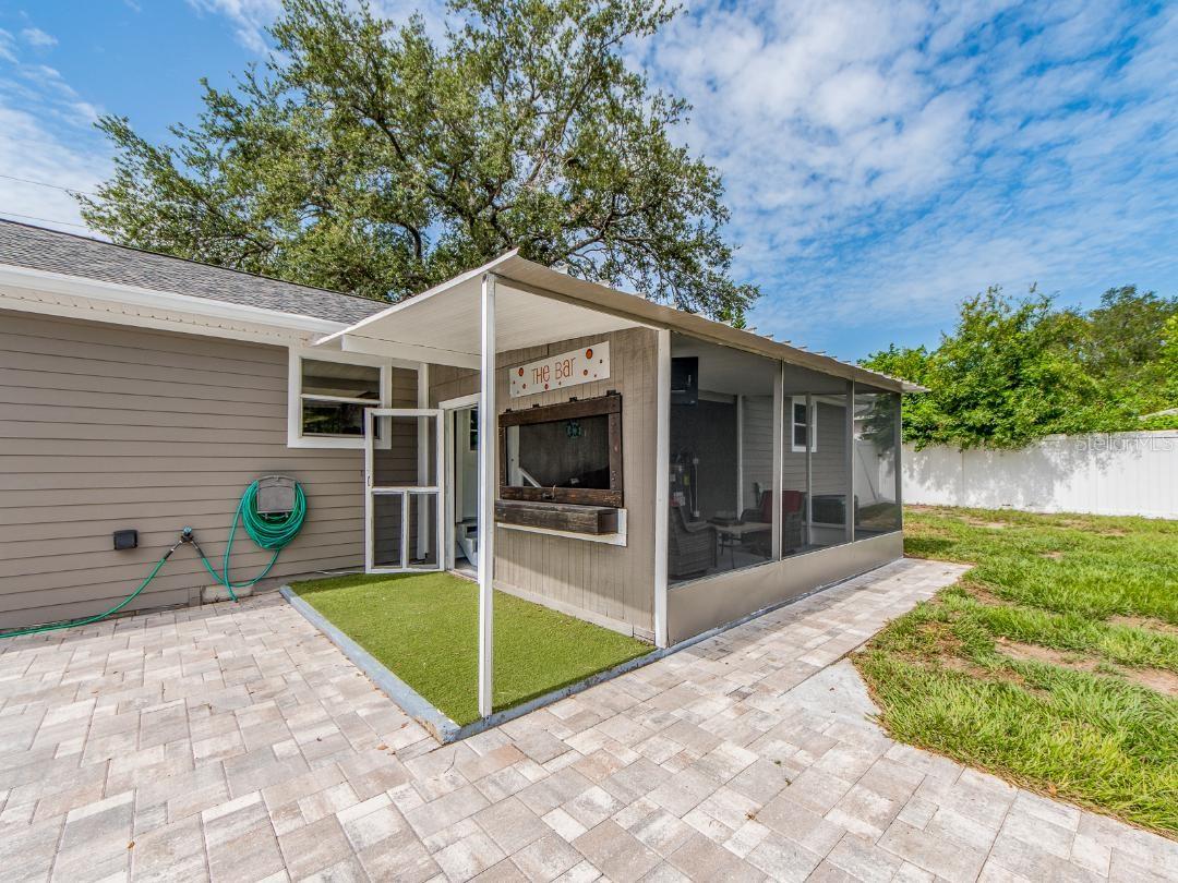 REAR OF HOME WITH PAVER PATIO