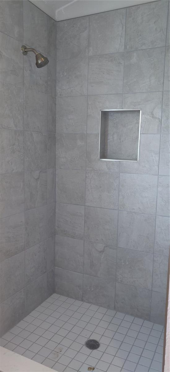 Primary shower will have glass doors.