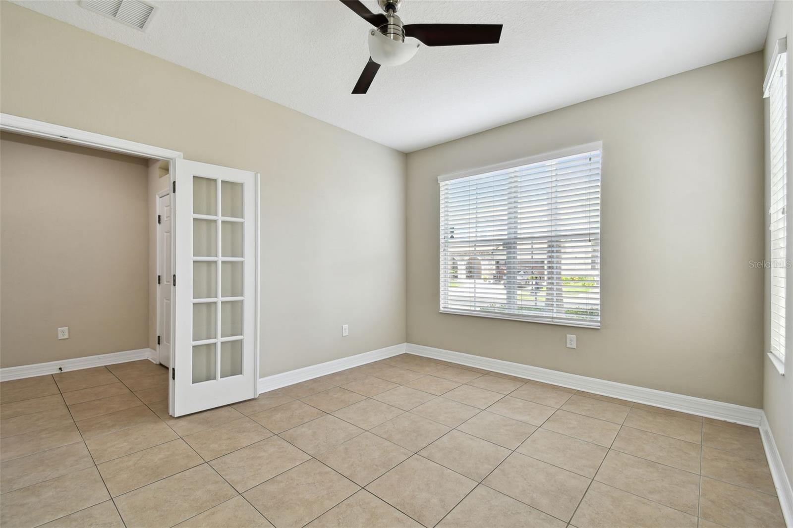 French doors open to a den/office!