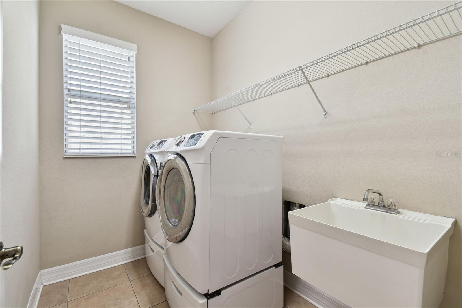 Samsung front loading washer and dryer, plus utility sink!