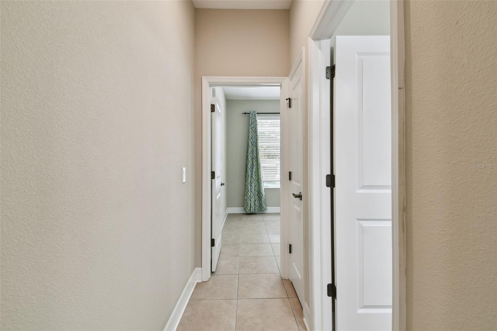 Private hallway to first floor bedroom and bathroom.