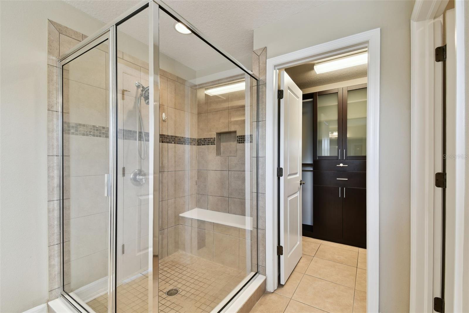 Large walk-in shower with bench!