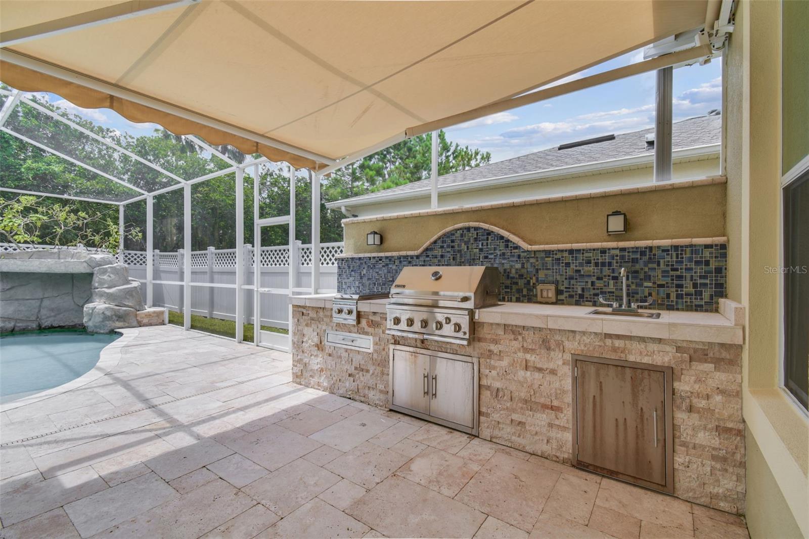 Retractable awning to fully shade outdoor kitchen!