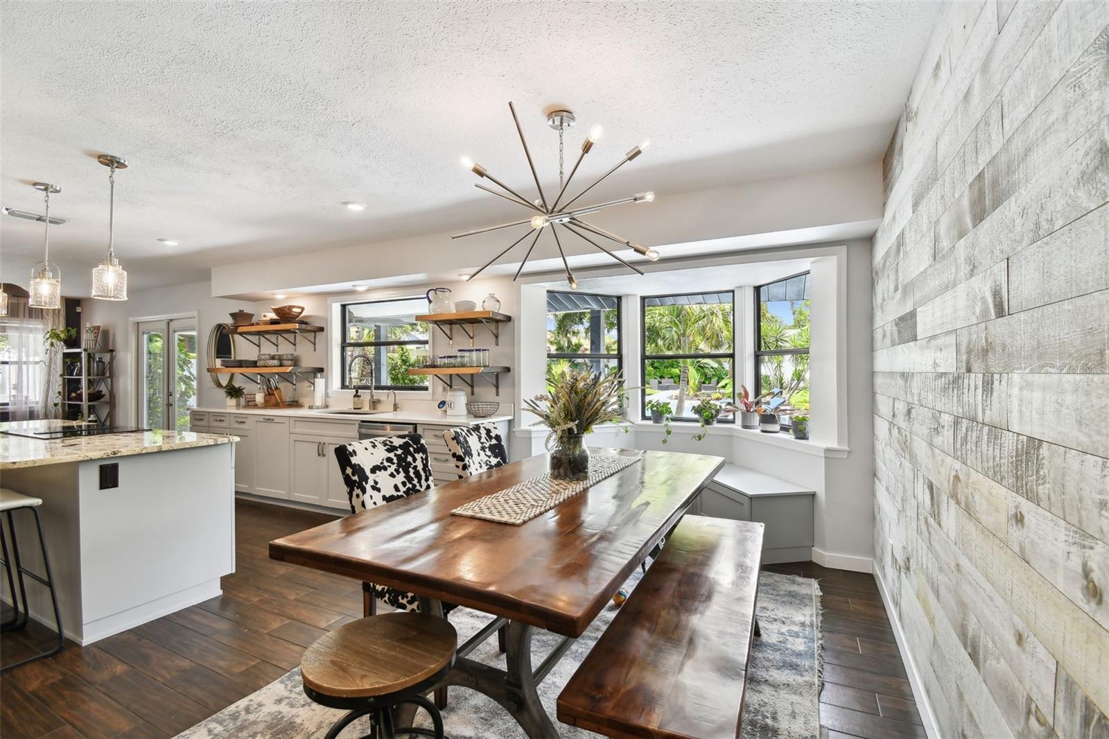 Bright and light - overlooking the pool area. Distressed wall accents. Window seat and bay windows.
