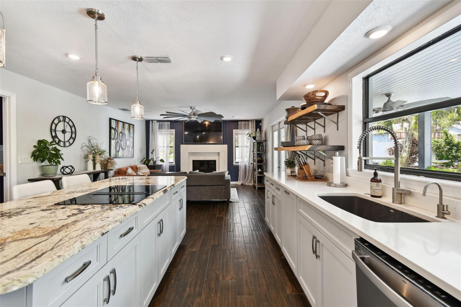 Gleaming quartz counters on the right and granite on the left. What a beautiful combo!
