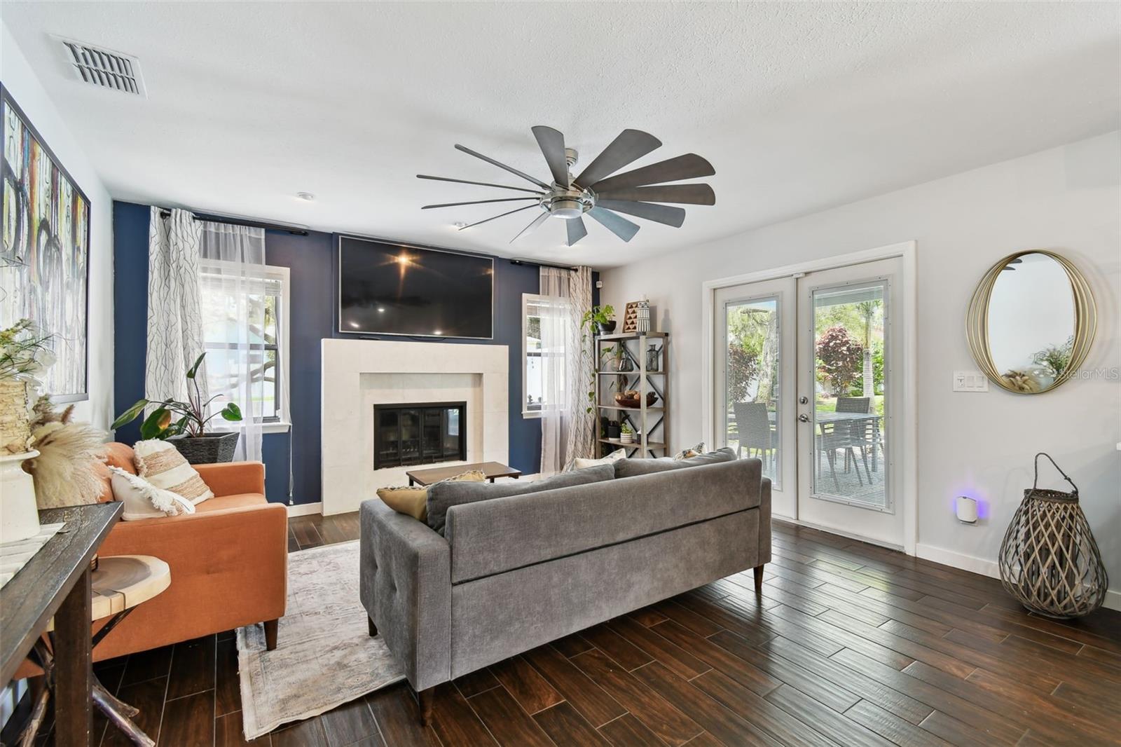 Cozy gathering area with fireplace.