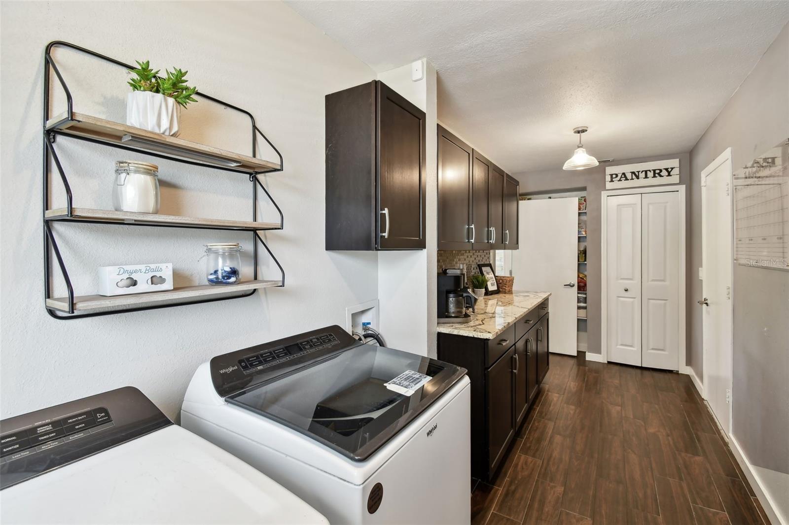 This well-appointed laundry room, makes doing laundry a breeze!
