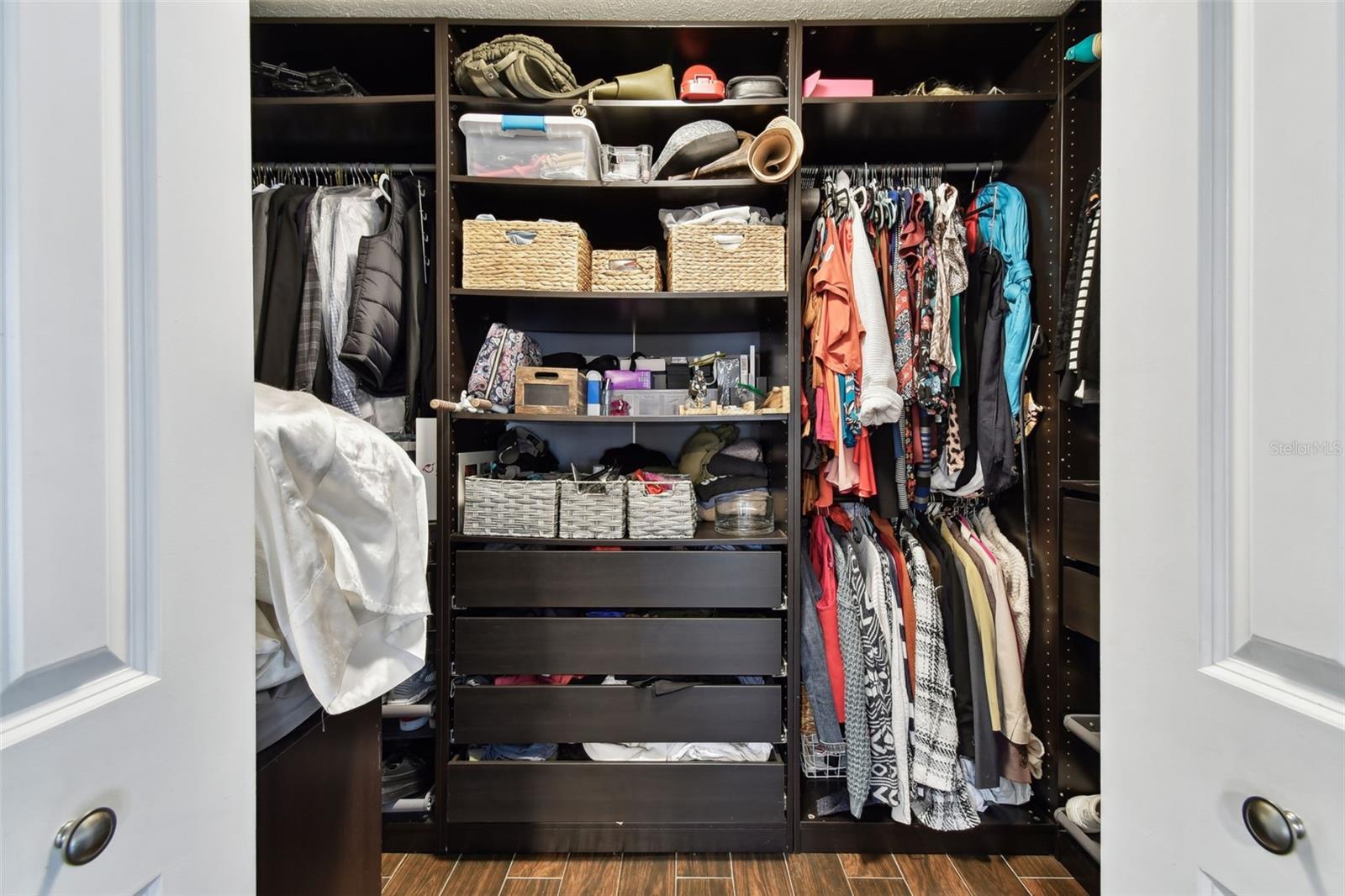 Primary bedroom walk-in closet.