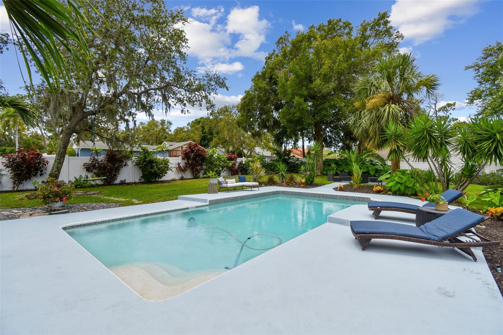 Your covered lanai overlooks your gorgeous pool and yard.