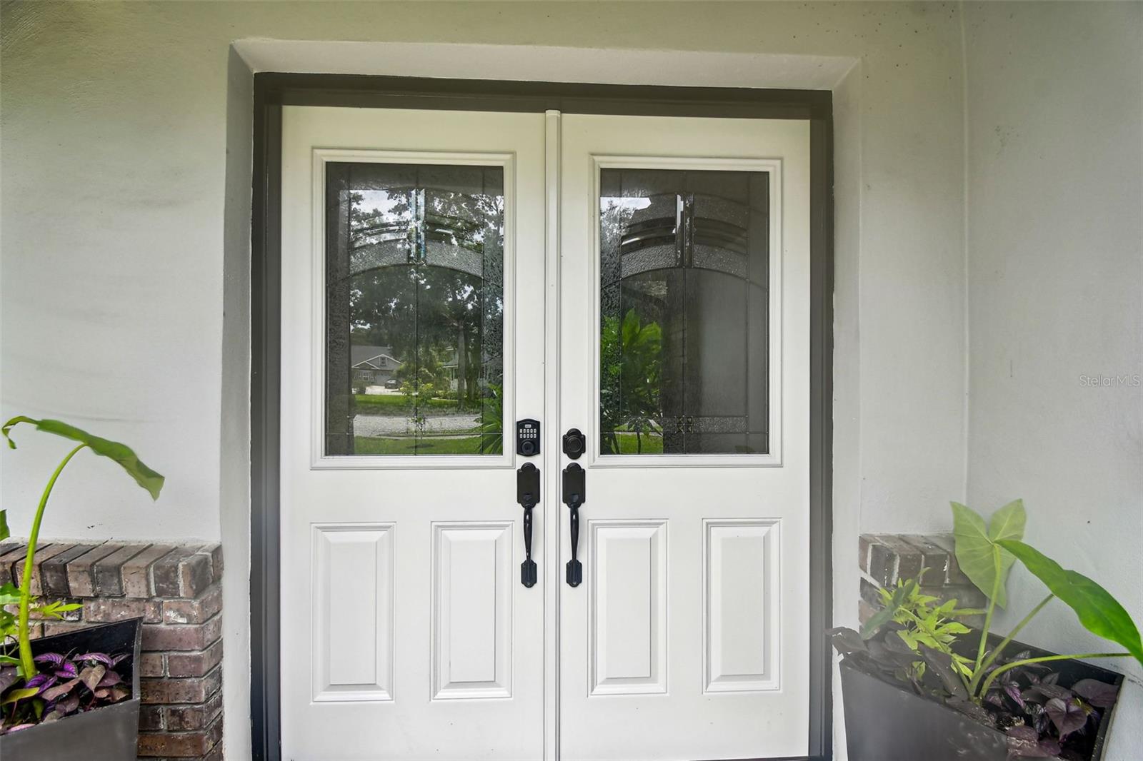 New front doors with designer glass insets.
